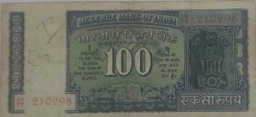 100 Rupees note Governor K.R PURI used (slightly damaged)